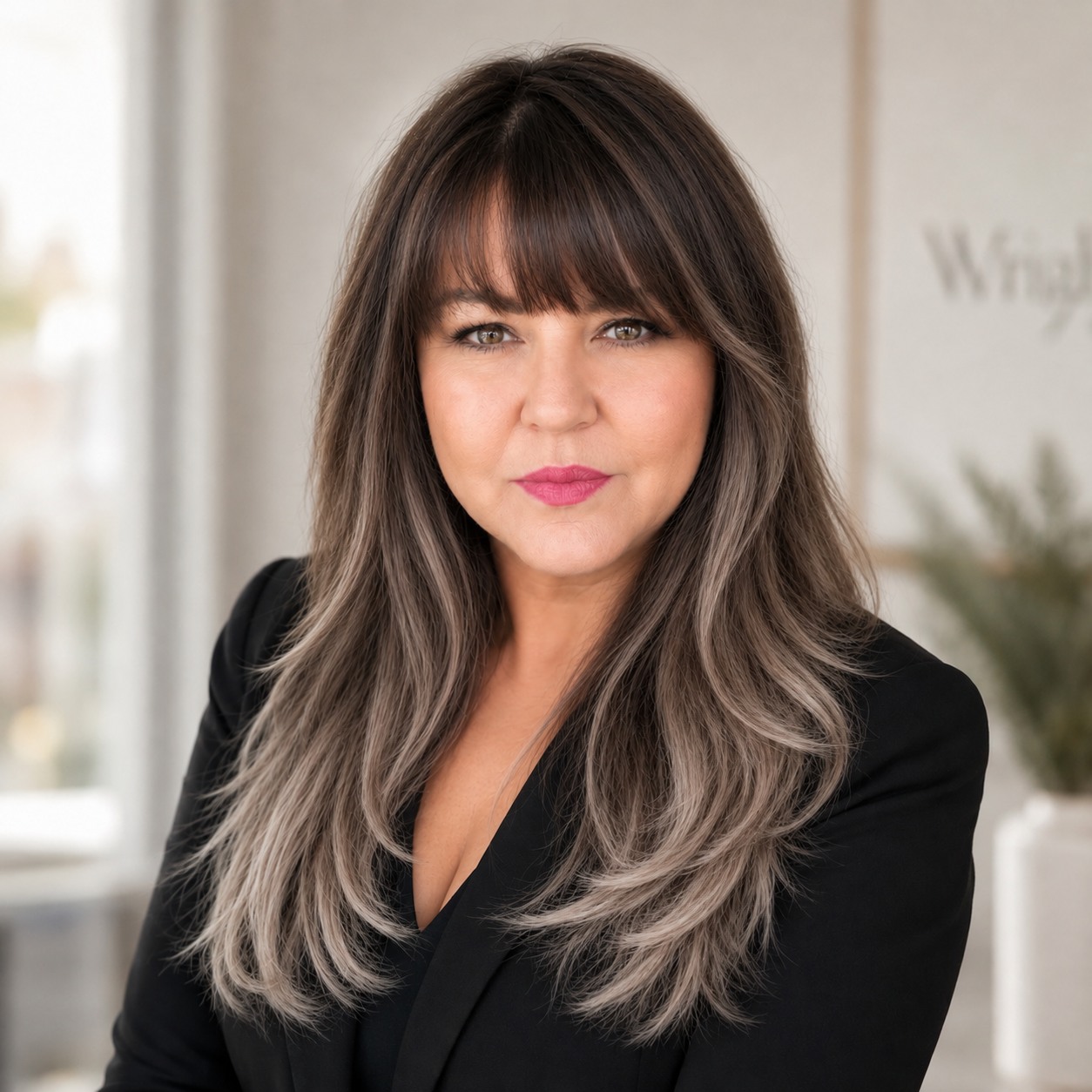 Jo Wright, Real Estate Broker, wearing a black suit